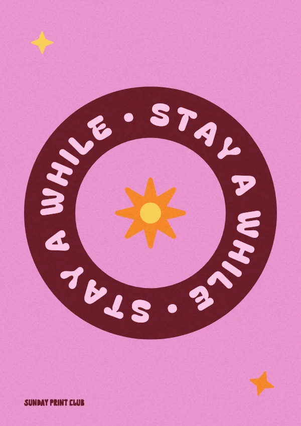 Stay a While print: the words stay a while repeated around a burgundy ring with an orange sunburst centre on lilac