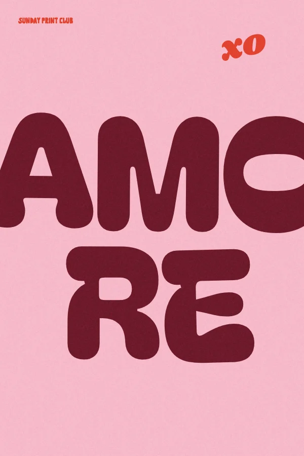 Amore print: oversized burgundy bubble letters spelling amore on a candy pink background