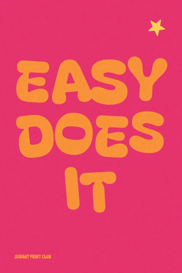Easy Does It print: wobbly orange bubble letters on a hot pink background with a small yellow star
